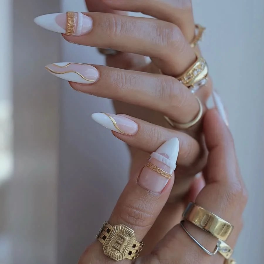 White and gold gel nails with fine gold detailing
